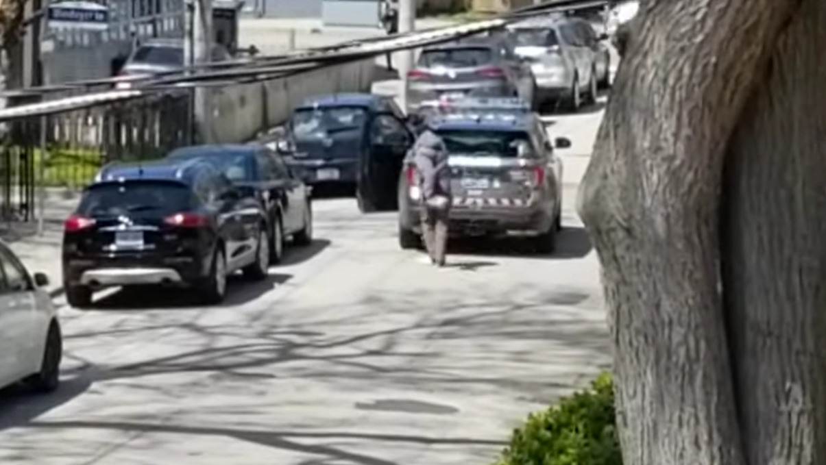 Video Shows A Suspected Porch Thief Throwing Rocks At Police